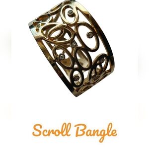 • Gold Tone, Scrolled Style Bangle •